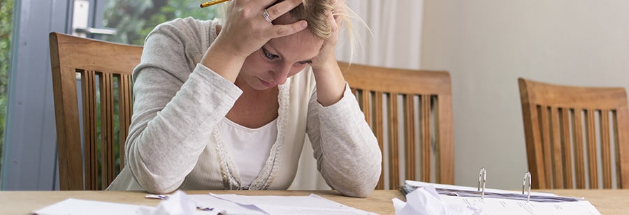 woman stressed by debt
